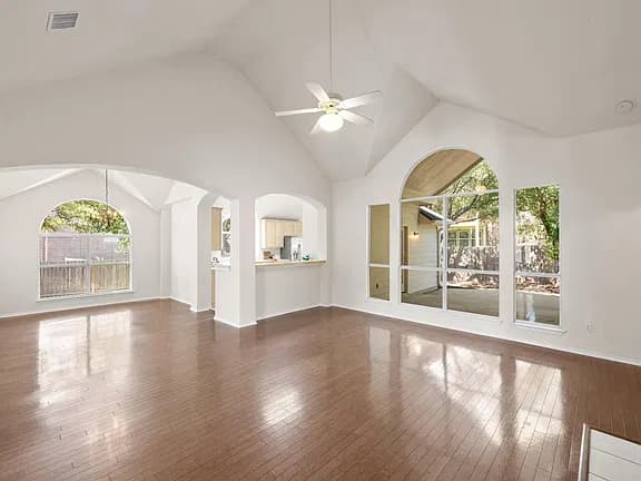 Before: the original photo used for the living room with white oak paneling and travertine table concept