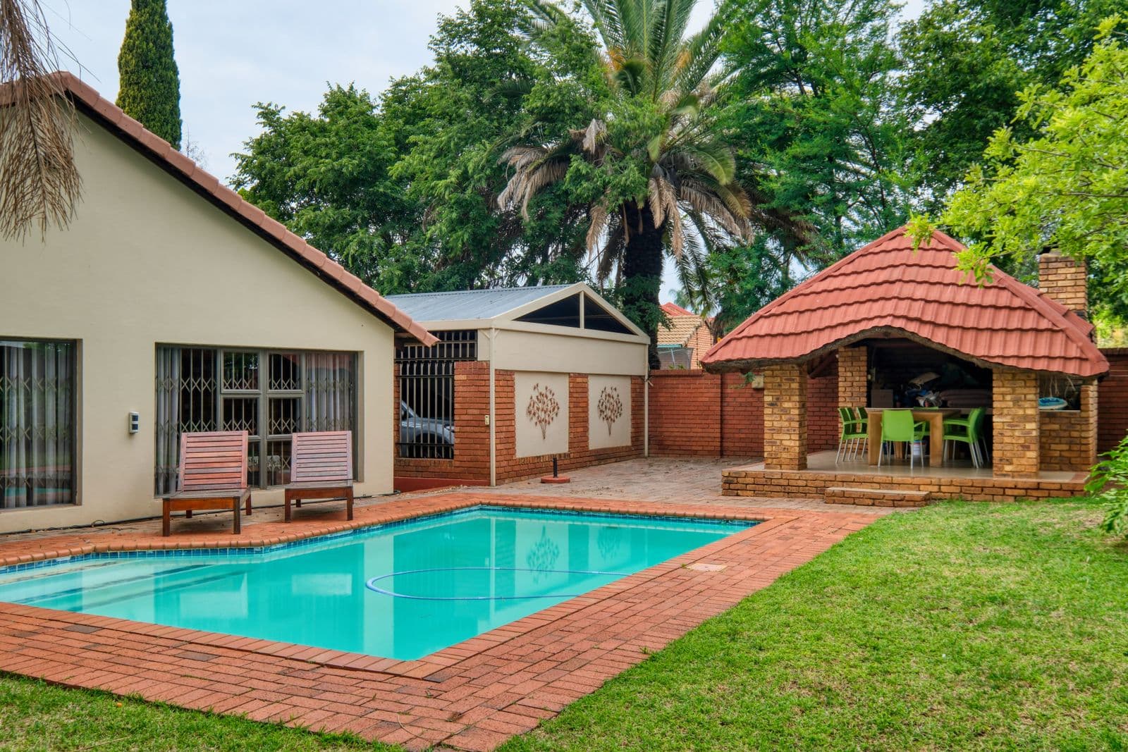 Before: the original photo used for the freeform lagoon pool with flagstone coping concept
