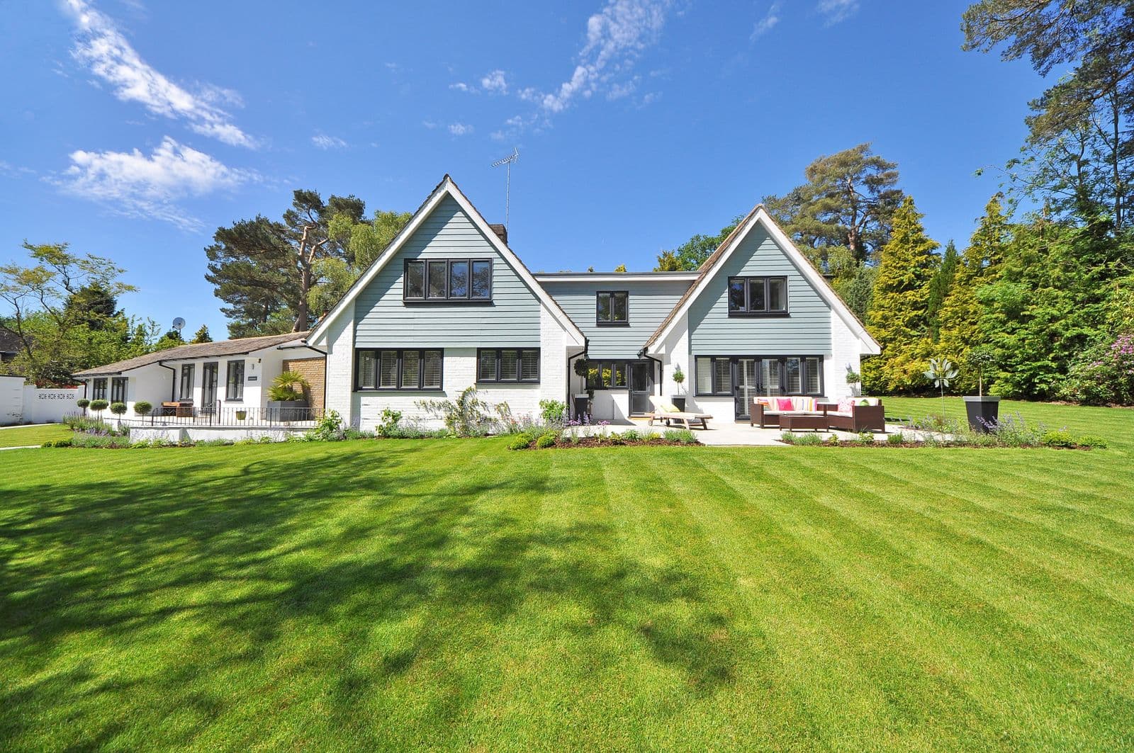 Before: the original photo used for the modern farmhouse with extensive landscape lighting concept